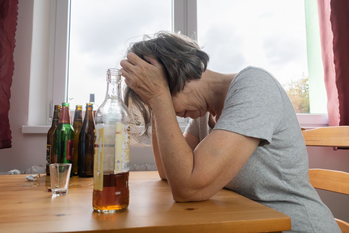 Old,Senior,Female,Woman,Sit,Next,To,Table,Drink,Alcohol