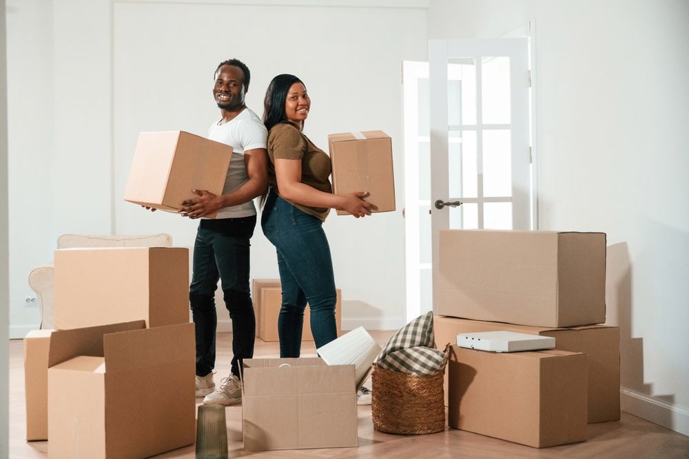 Bunch,Of,Boxes.,African,American,Couple,Are,Moving,Into,New